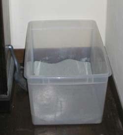Large, uncovered storage boxes make perfect litter boxes for cats.